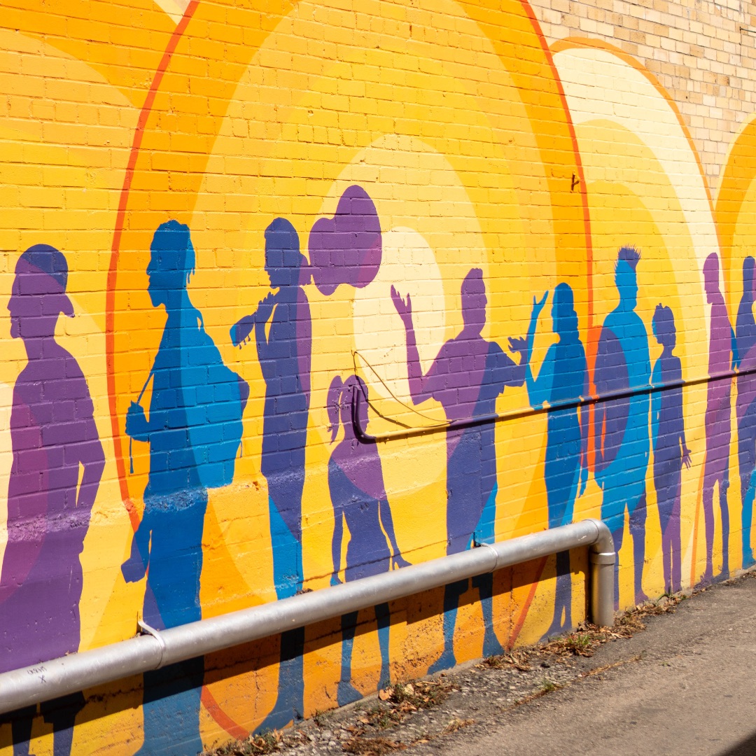 Colorful mural on brick wall