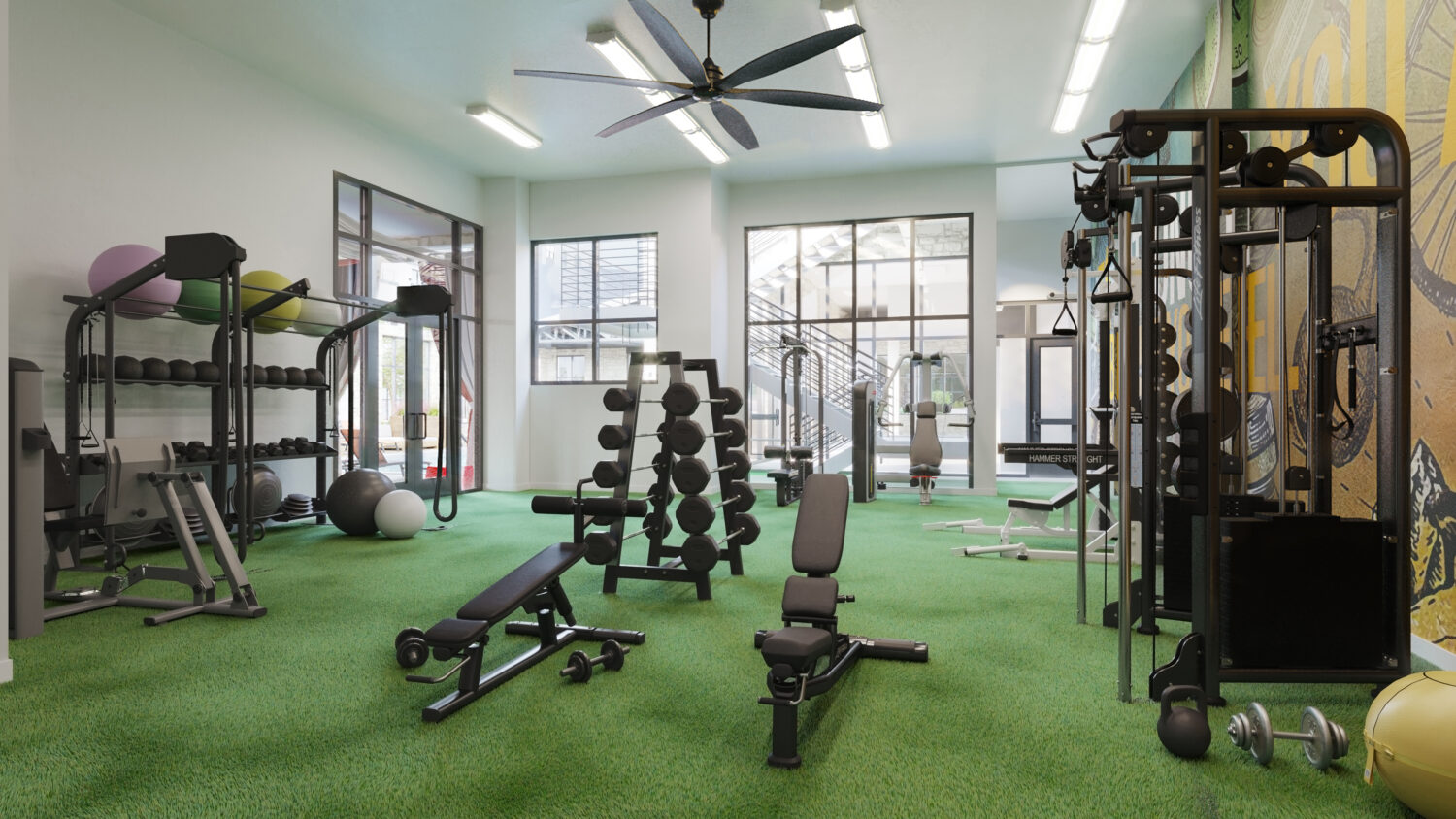 Fitness center with medicine calls, free weights, benches, cable machines and ceiling fans